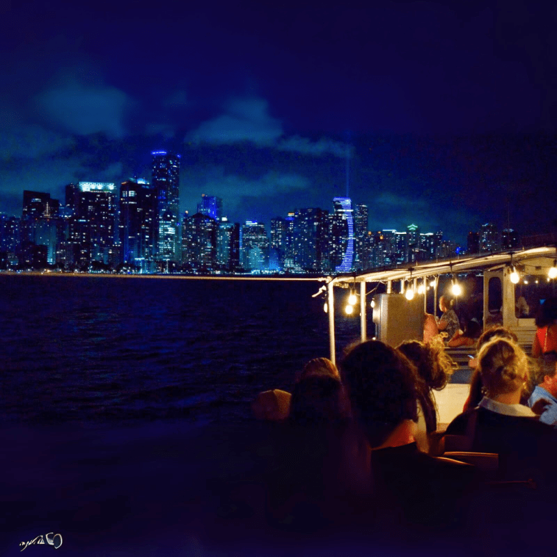 a group of people sitting at night