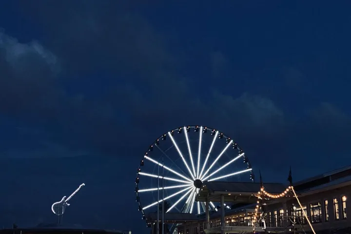 a large body of water with a city in the background