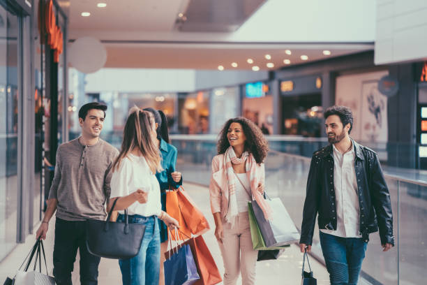 a group of people walking on a sidewalk