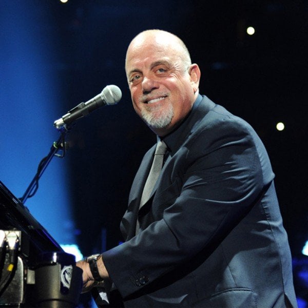 Billy Joel standing on a stage