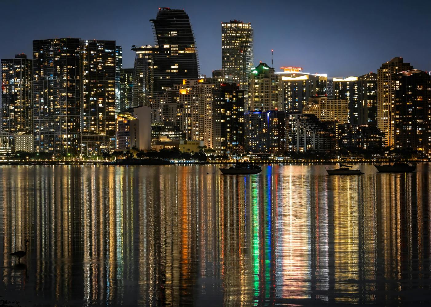 a large body of water with a city in the background