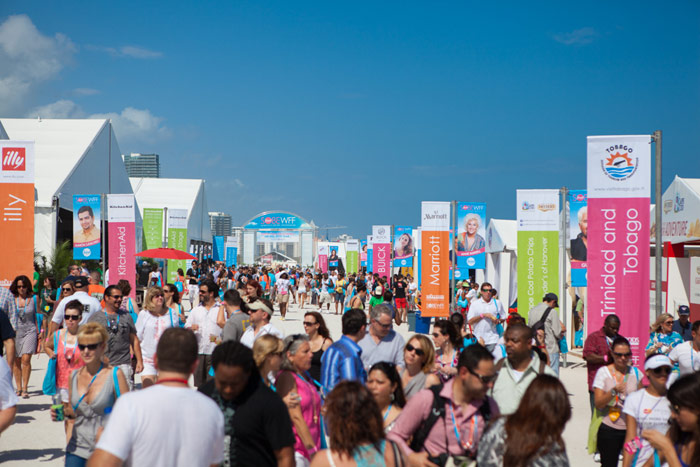 a group of people standing in front of a crowd