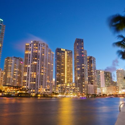 a large body of water with a city in the background