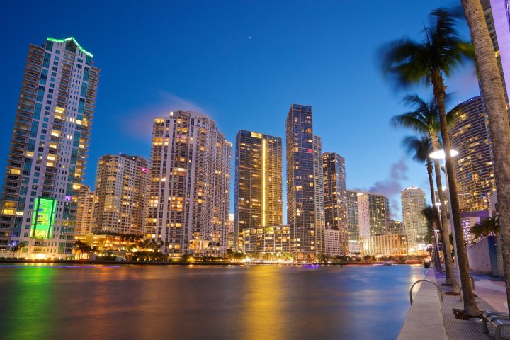 a large body of water with a city in the background