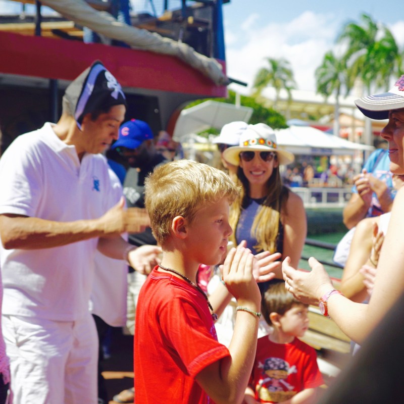 a group of people standing next to a person