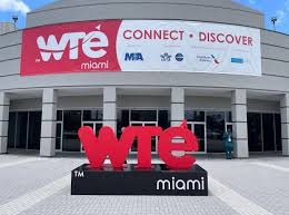 Building entrance with 'wté miami' sign and banner reading 'CONNECT • DISCOVER' above doors.